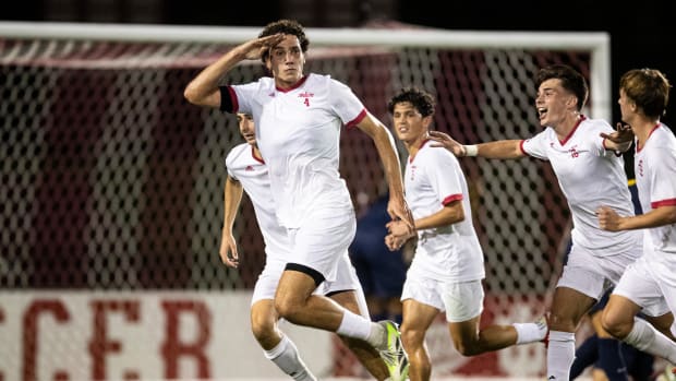 Nov. 8, 2023. Indiana's Hugo Bacharach (4) celebrates with teammates during the Big Ten Tournament semifinal at Bill Armstrong Stadium. The Hoosiers won 4-3.